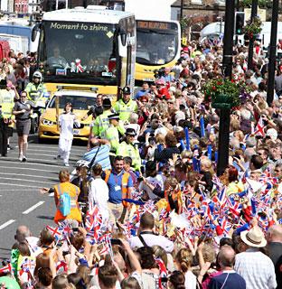 Crowds cheer on the Olympic torch in Northallerton