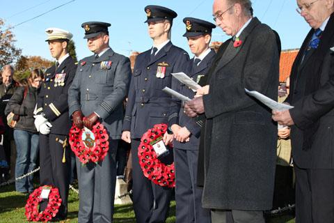 French, Australian and British servicemen observe the two-minute silence at the Remembrance Day Service in Elvington 
