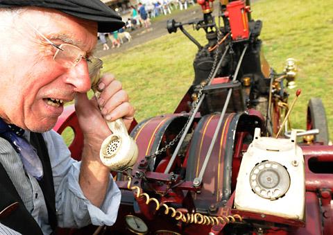 Kieran Collins with one of his mod cons  -     a telephone on his traction engine