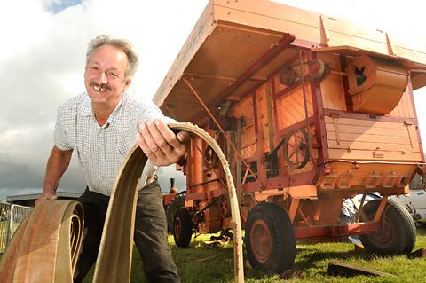 Paul Beal of West Knapton prepares the drive belt for his Foster threshing machine  