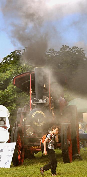 A youngster protects his mouth from the smoke at the Pickering Traction Engine Rally