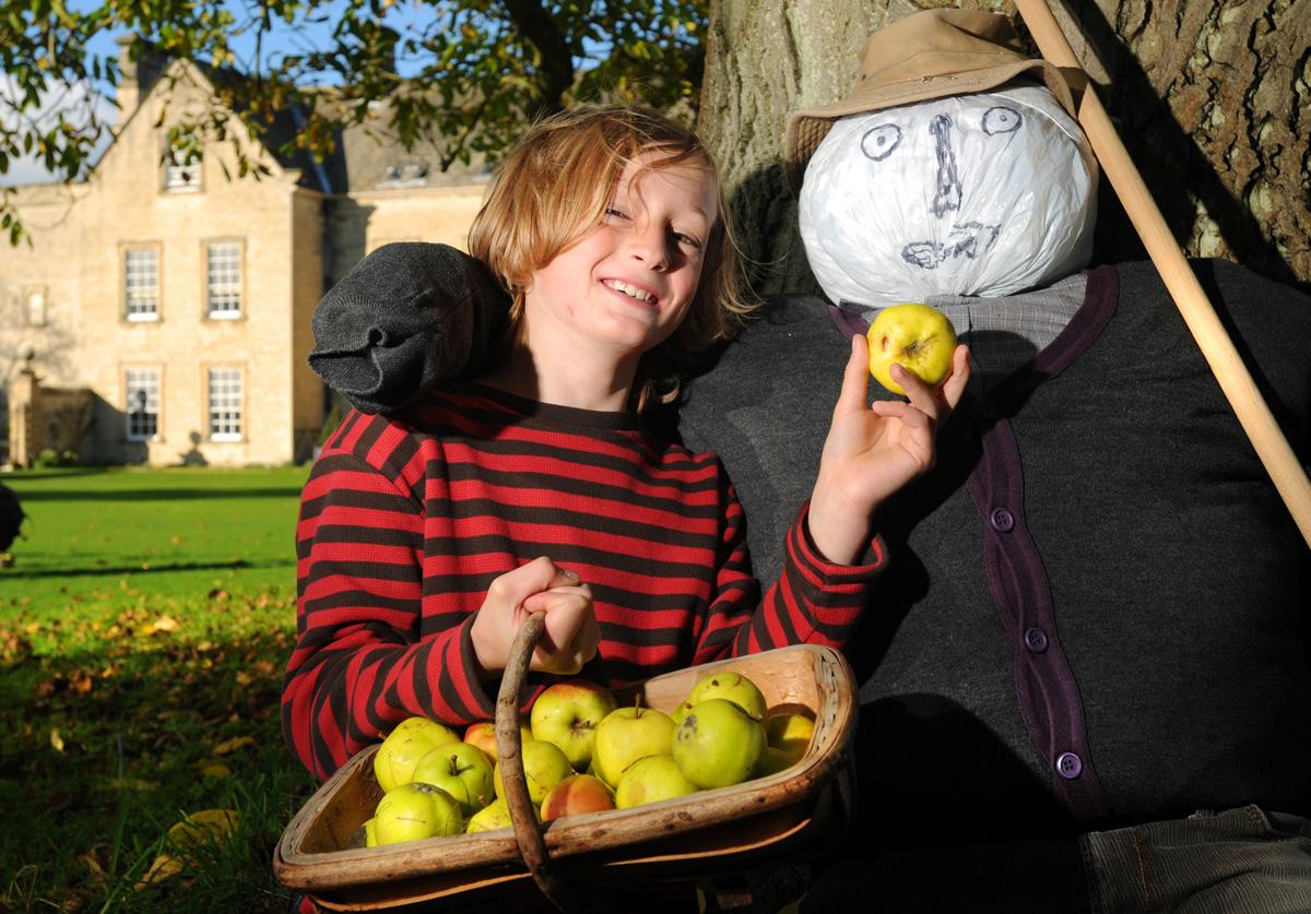 Max Pennington finds a scarecrow at Nunnington Hall during its autumn festival.
