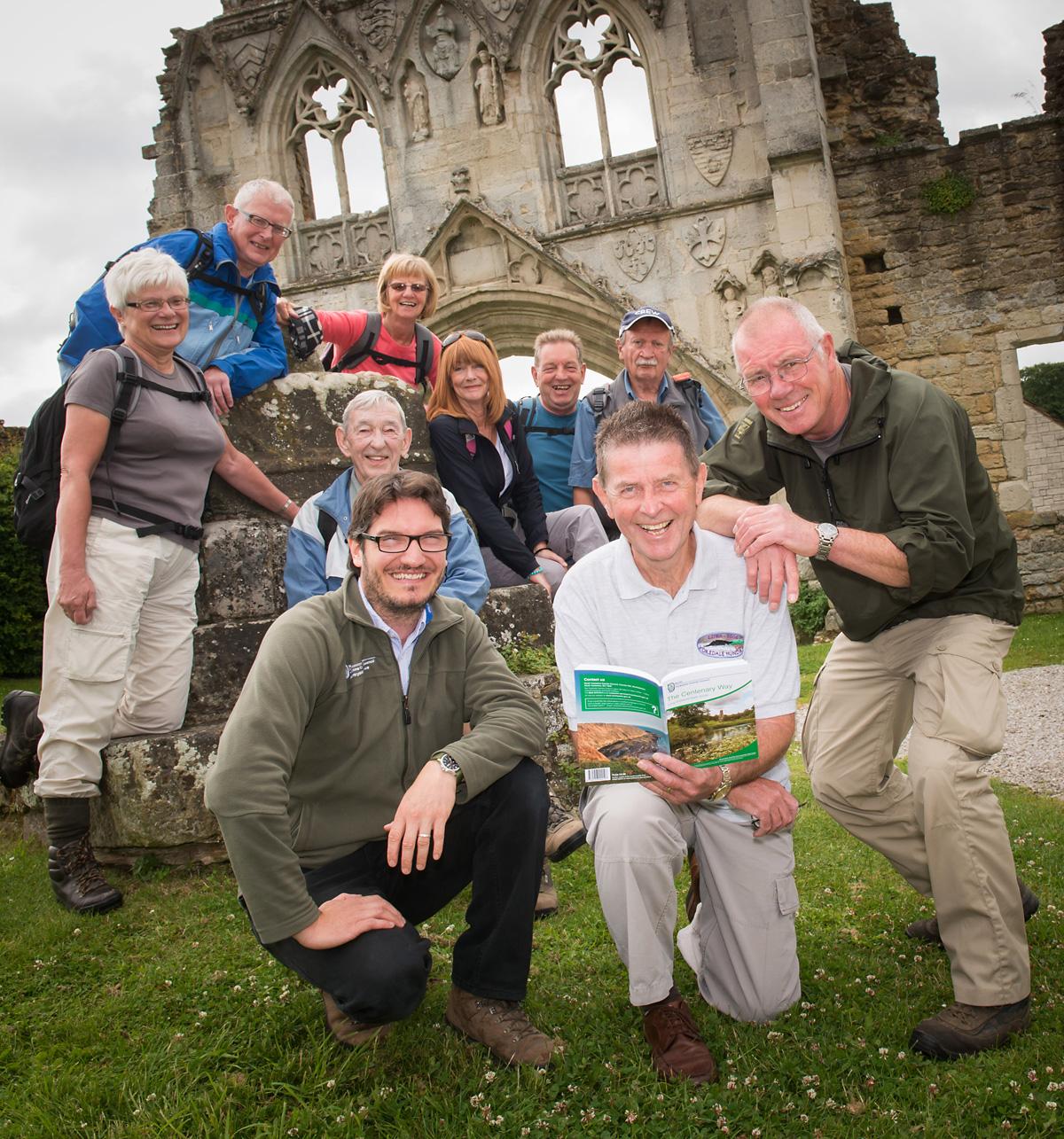  Author John Sparshatt, ranger Ben Jackson and countryside volunteer Mike Barney are joined at Kirkham Abbey by enthusiastic walkers at the launch of a new walking guide to the reopened Centenary Way which runs from York Minster to Filey Brigg.