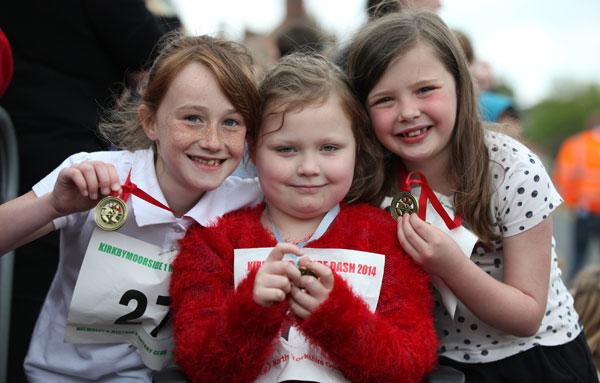 Eight-year-olds Ebony, Amira with Mia, 7, who all took part in the one mile race at Kirkbymoorside