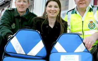 Gazette & Herald reporter Karen Darley with community defibrillation officer Neil Marsay, left, and First Responder Chris Speedie, and the new kit bought by the Pulse Appeal
