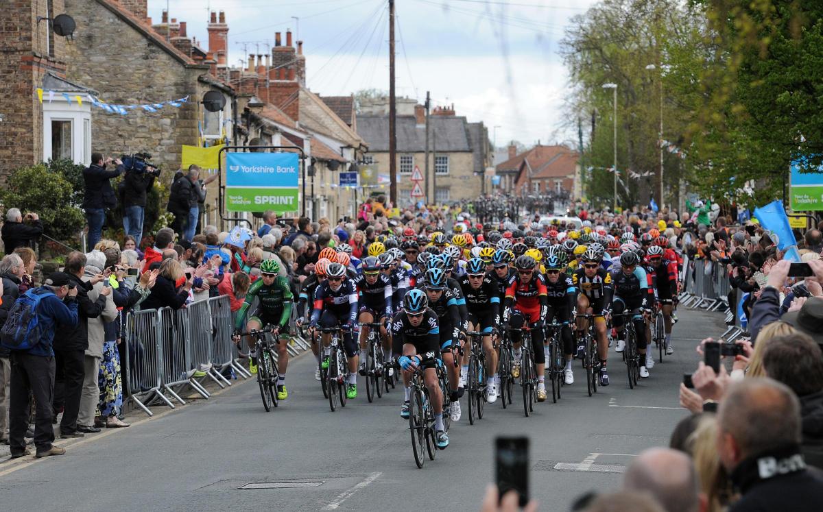 The peloton makes its way along Westgate in Pickering during Stage One of the Tour de Yorkshire. Picture: Anna Gowthorpe