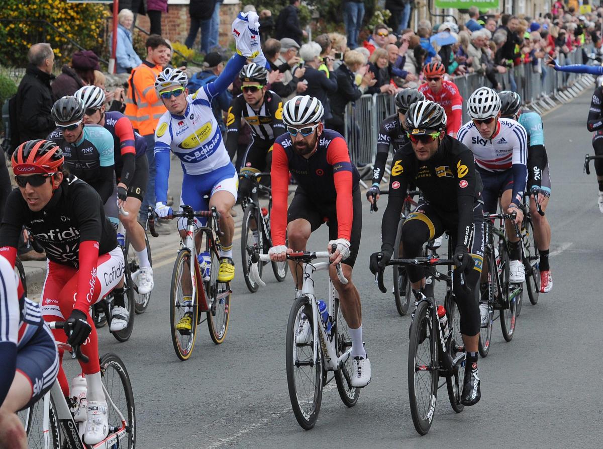 Sir Bradley Wiggins (centre) rides inside the peloton as it makes its way along Westgate in Pickering during Stage One of the Tour de Yorkshire. Picture: Anna Gowthorpe