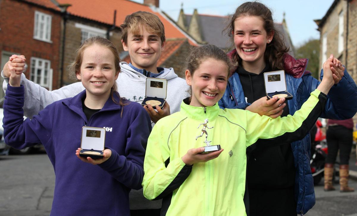 Sisters Hattie and Georgie Eve, right, who won in their age groups in the 4k and the mile races, and Maurice and Martha Carlton-Seal, the fastest boy and girl overall in the 4k race