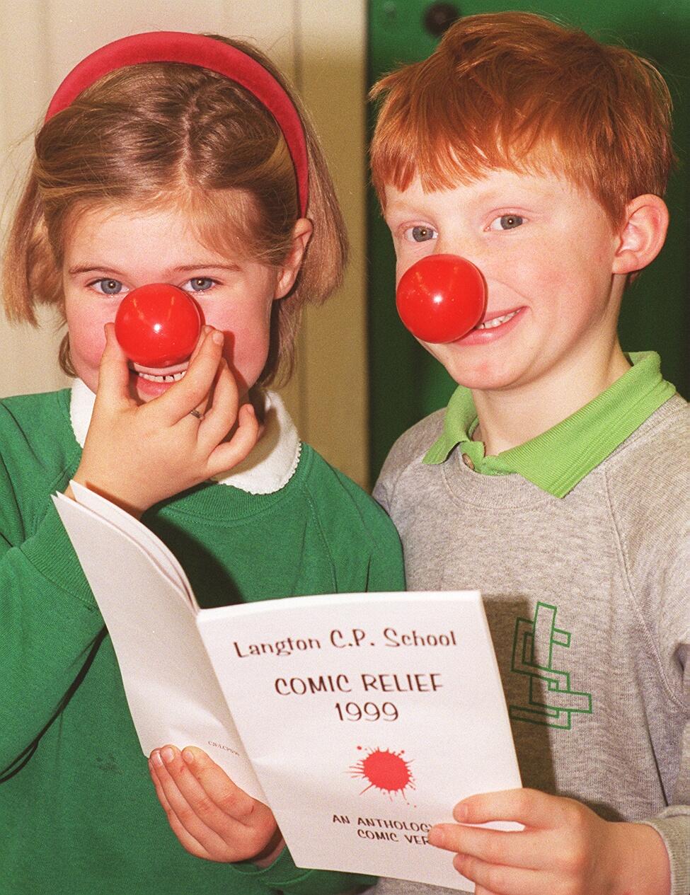 1999: Langton County Primary School kids L-R, Lorna Robertson 6, and Alistair Fothergill 6 with their Comic Relief limerick book.
