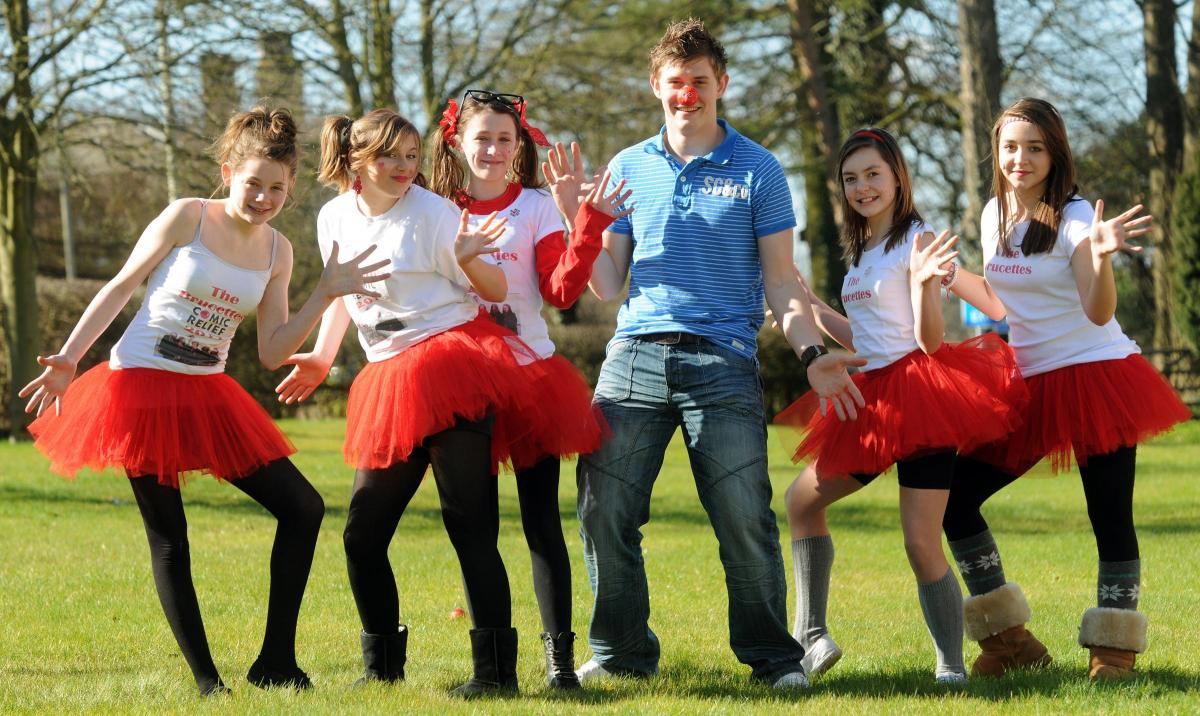 2011 Malton School maths teacher Phil Bruce with the Brucettes (from left) Megan Bell, Maddie Dean, Annabelle Francis, Beth Anderson and Holly Fletcher, ready to take part in the Cha Cha Slide for Comic Relief. Pic: Mike Tipping