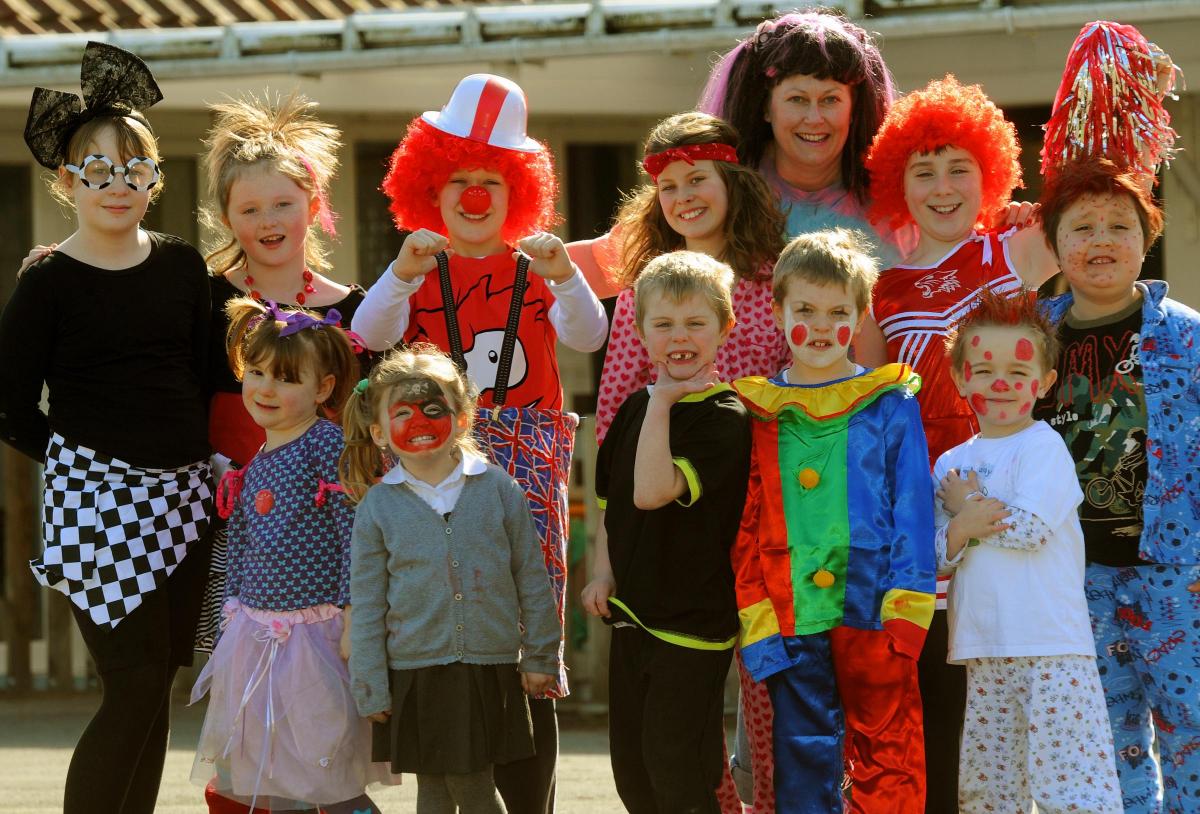 2011 Children at Langton School dressed up for Comic Relief, with school secretary Sue Wright. Pic: Mike Tipping