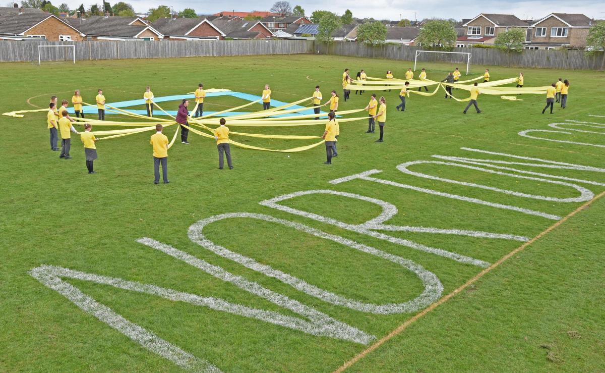 Pupils at Norton College help create a cycle in the school grounds to celebrate Tour de Yorkshire