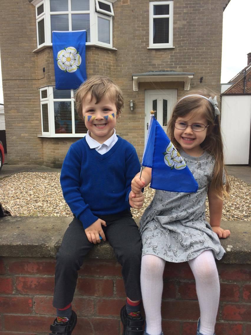 Best friends George and Layla on Langton Road in Norton celebrating the Tour De Yorkshire.
