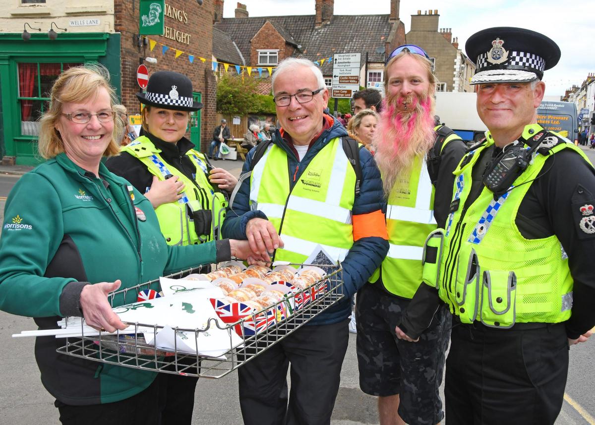 The Tour de Yorkshire in Malton. Pictured with Amanda Robinson who was handing out free doughnuts from Morrisons are Acting Inspector Donna Musgrove, Tour Makers Roger Lazenby and John Salter and Chief Constable Dave Joines. Picture David Harrison.