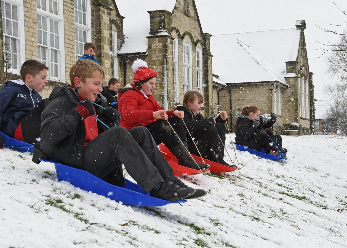 Pictured at Pickering Junior School on Thursday morning are pupils enjoying the snow. Picture David Harrison.