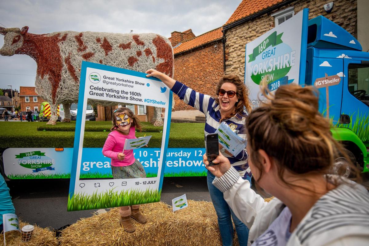 Saturday 26thMay  2018, Malton
Picture Credit Great Yorkshire Show / Charlotte Graham

Picture Shows A little girl has her Photo taken by her mum as Charlotte Handley from the Great Yorkshire Show Team Holds the sign