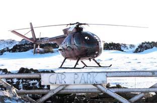 A helicopter landing at the snow-covered car park of the Lion Inn, at Blakey, on the North York Moors. Picture by Gerry Orchard.