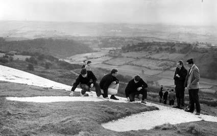 Linton-on-Ouse trainee RAF pilots work on cleaning and restoring the white horse of Kilburn in 1967. 