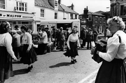 The Cat Nab Cloggies, a clog dance team from Saltburn, perform during the Malton Folk Festival in 1987.