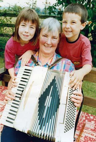 Joseph Thorpe and his sister, Laura, join their grandma Mary Newton a she tunes up for Malton's 10th annual folk festival.
