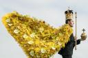 Rupert North wears a majestic robe created using an array of flowers and leaves, that will form the centrepiece of the Harrogate Spring Flower Show, which this year celebrates the coronation of King Charles III. Picture: PA
