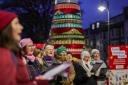 The Hackness Ladies’ Choir sing in front of an alternative Christmas tree in Trafalgar Square, Scarborough