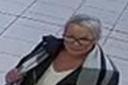 A CCTV image of a woman police would like to speak to following a theft at the Designer Outlet Holland and Barrett in York