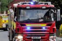 Firefighters tackle burning agricultural building