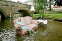 Topsy Clinch takes tea in Pickering Beck in 2008 to highlight the impact of flooding in the town