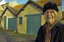 Linda McCarthy, secretary of the Charles Dickens (Malton) Society in front of one of the old Travis Perkins buildings.