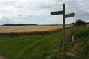 A view down Holm Dale, top, a Yorkshire Wolds Way marker post near Glebe Farm