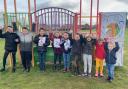 Youngsters celebrate receiving £2,000 towards Sherburn playing field.