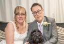 ‘Hero’ hearing dog, Pickle, with owner Kirsten Carmichael and her husband, Matt, on their wedding day