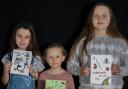 Lucky winners of the Children's Christmas Card Competition were Nancy, aged eight,  Holly, five ,  10-year-old Ellie.