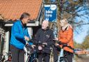 Rob Brown from Dalby Forest Cycle Hub, who has been nominated for Visit England's Tourism Superstar award, shows a couple how to use E-bikes