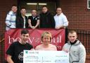 Handing over the funds are, Ryan Swain, front left, and Scott Simpson, front right with Louby’s mum Emma Robertson-Tierney, and back row, Kain Atkinson,  Paul Archer, Jez Kipling, Sam Brookes and Brendan Douthwaite