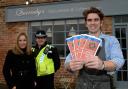 Will Quarmby, from Quarmby’s Delicatessen and Coffe House, in Sheriff Hutton, with Christmas Crime Prevention menus, which will be available to customers, provided by Gail Cook, from Ryedale District Council, left, and PCSO Nicki Pounder
