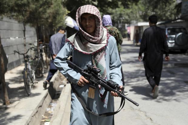 A Taliban fighter standing guard at a checkpoint in the Wazir Akbar Khan neighborhood of the city of Kabul on Sunday. Picture: AP Photo/Rahmat Gul