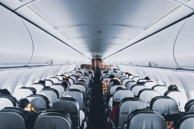 Gazette & Herald: Rows of empty seats on a plane. Credit: Canva
