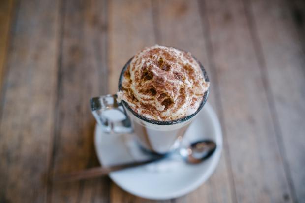 Gazette & Herald: A hot chocolate topped with cream and sprinkles (Canva)
