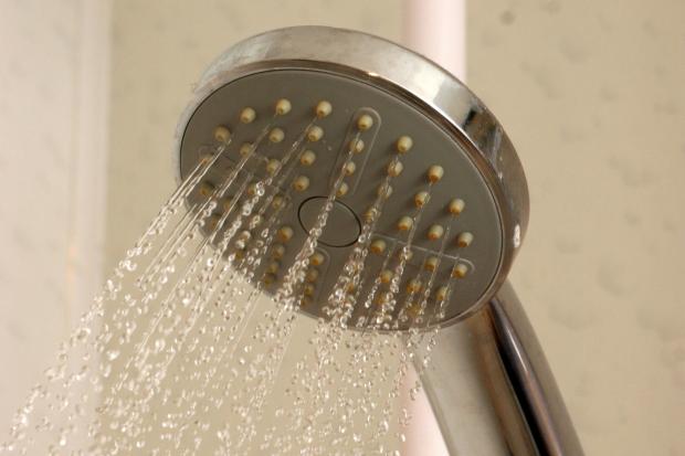 Gazette & Herald: Shortening the length of your shower is one way to save money (Canva)