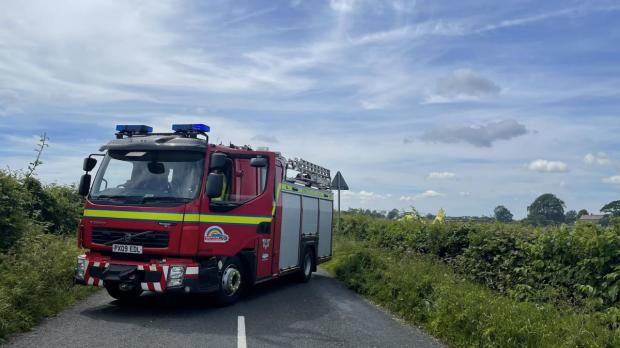 Gazette & Herald: Fire engine blocking the road to the scene of the crash at the edge of the Yorkshire Dales Picture: Tom Beresford