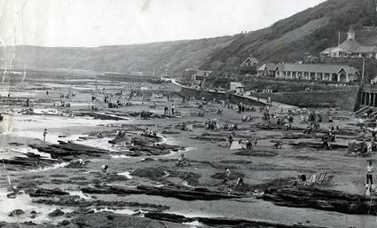 Children playing in rock pools left by the retreating tide on Scarborough's South Bay in 1970.