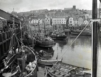 Boats of the Scottish herring fleet make a picturesque scene as they lie in the harbour at Scarborough in 1957.