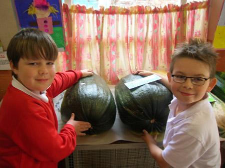 James Roger, 10, (left) and Luca Craggs, (nine), weigh up the size of these spectacular marrows at Rillington Horticultural Show