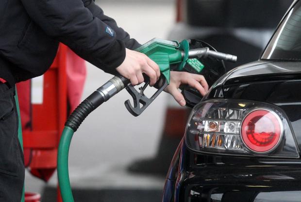 Gazette & Herald: Someone using a fuel pump at a petrol station (PA)