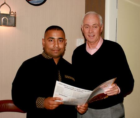 Desi Spice Club owner Kalum Ali Shah (left) and Ryedale Lion Mike Evans discussing the menu items to be included in the special Indian banquet