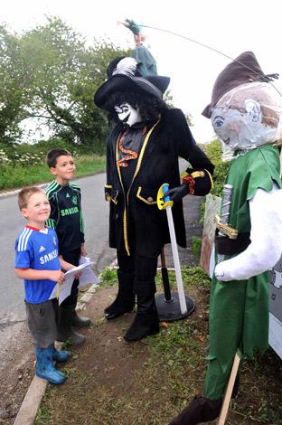 Two young residents come across Peter Pan and Captain Hook on the Foston scarecrow trail.