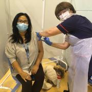 Elizabeth Lowery, Medical Lab Assistant being vaccinated by Carol Halton, Matron