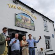 Sir Phillip and Tom Naylor-Leyland visited The Spotted Cow after it reopened last month